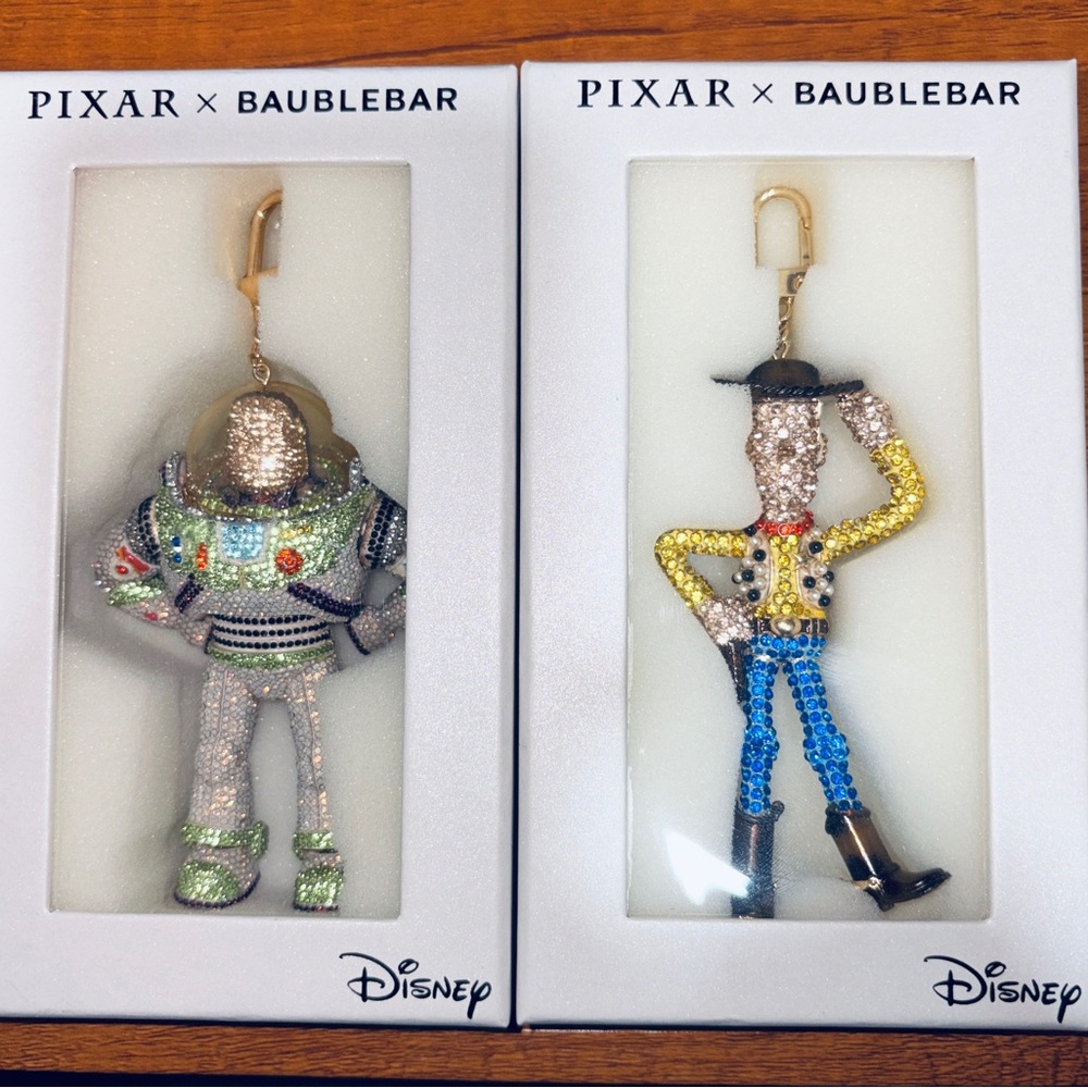 BaubleBar Disney Pixar Bag Charms - BUZZLIGHTYEAR AND WOODY BAG CHARM LOT.